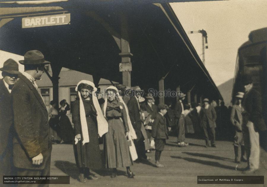 Postcard: Busy scene on the platform of the Bartlett railroad station